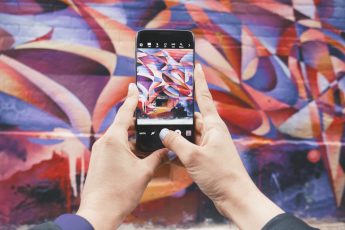 colourful mobile in hands amp support